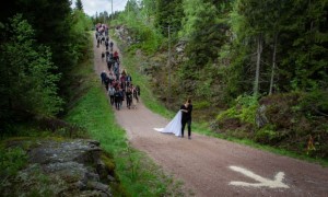 Han leads a procession through Nordmarka forest